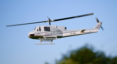 Large RC helicopter flying in clear sky