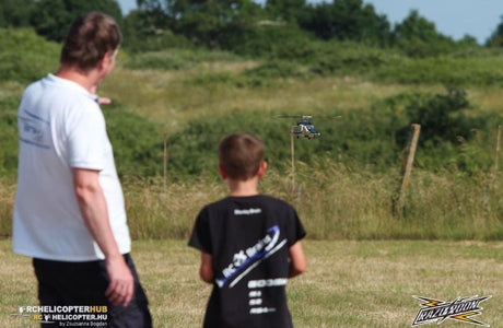 8-year-old flying WOLFBUSH AW-911 RC helicopter with adult