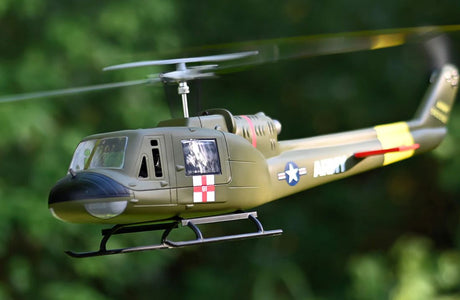 FlyWing UH-1 Huey V4 scale RC helicopter fuselage detail, class 470 brushless motor GPS model in military green.