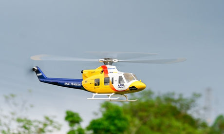 A Military RC Helicopter fly in the sky.