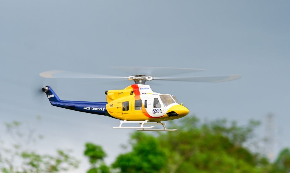A Military RC Helicopter fly in the sky.