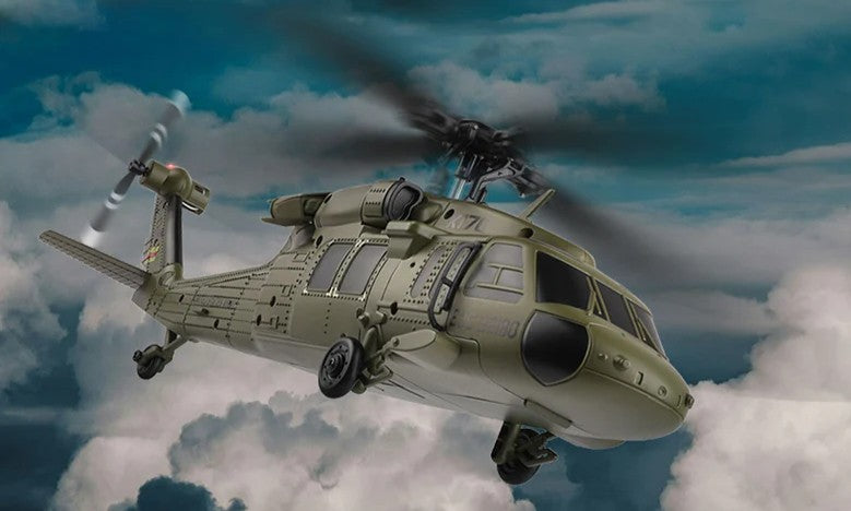 WLTOYS K170 Black Hawk UH-60L scale RC helicopter in military olive drab flying in the sky.